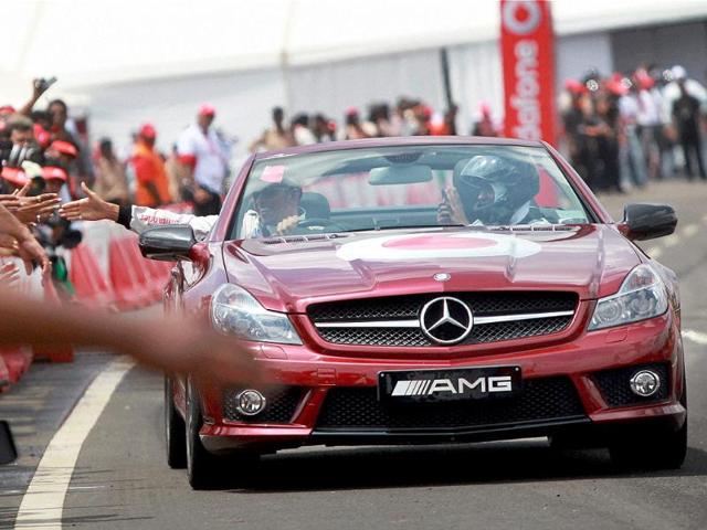 Mclaren Mercedes driver Lewis Hamilton weaves his award winning MP4-23 car during the Formula One car run at Nice road in Bangalore.