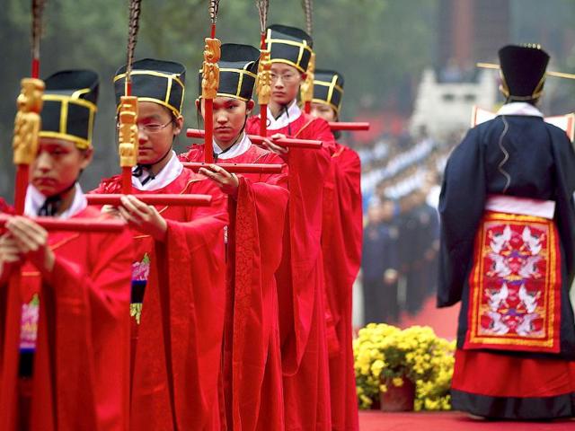 School children dressed as ancient Chinese scholars take part in a traditional ritual to celebrate Confucius’ birthday, known as National Teacher's Day in China at the Confucius Temple in Beijing, China.