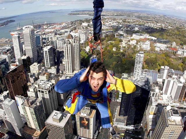 Skyjumper Brad Smith performs a skyjump atop the Sky Tower in Auckland.