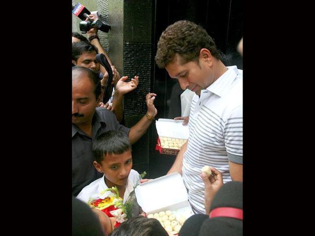 Sachin Tendulkar talks to the media after shifting to the new house at Perry Cross Road in Bandra, Mumbai.