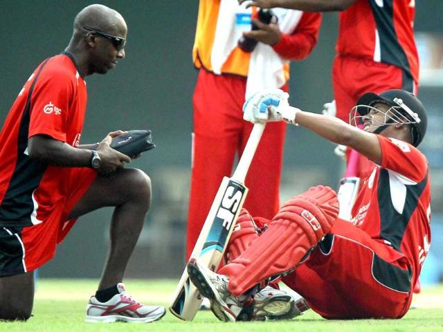 Trinidad & Tobago player Lendl Simmons grimaces of pain during the Champions league T20-2011 match against New South Wales Blues in Chennai.