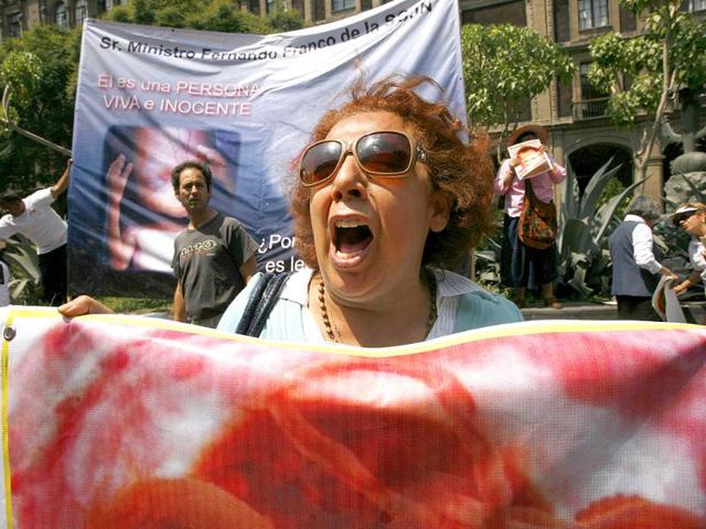 An anti-abortion activist demonstrates during a protest against Mexico's Supreme Court in Mexico City.