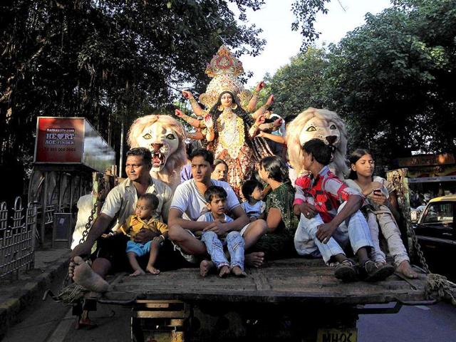 Devotees carry an idol of Goddess Durga for worship during Navratri festival in Mumbai.