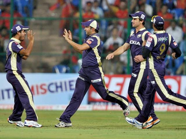 Gautam Gambhir celebrates the catch of Royal Challengers' batsman Virat Kholi (unseen) with his teammates during the Champions League Twenty20 League cricket match between Royal Challengers Bangalore versus Kolkata Knight Riders at the M. Chinnaswamy Stadium in Bangalore.