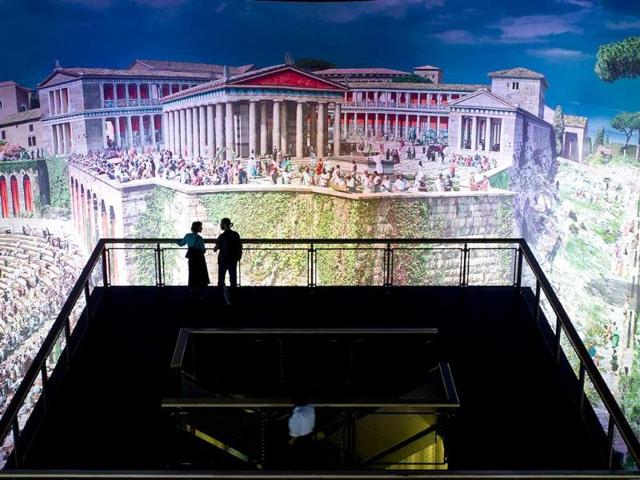 Visitors look at the work titled "Pergamon - Panorama of the Ancient Metropolis" during a preview at the Pergamon museum in Berlin. The giant 360 degrees panorama measuring 103 meters in length and 25 meters in height by Austrian-born artist of Iranian origin Yadegar Asisi will be on display at Berlin's Pergamon Museum - Classical Antiquities Collection from September 30, 2011 to September 30, 2012.