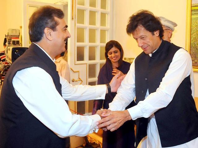 Pakistan's Prime Minister Yusuf Raza Gilani receives cricketer-turn-politician Imran Khan for an all parties conference in Islamabad, Pakistan.