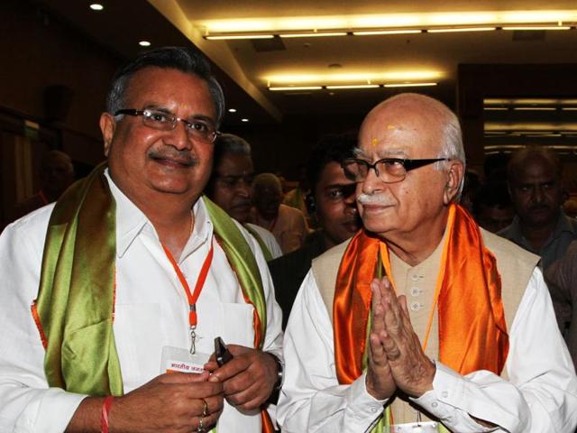 BJP leaders LK Advani with chief minister of Chhattisgarh, Raman Singh during national executive committee meeting of BJP in New Delhi.