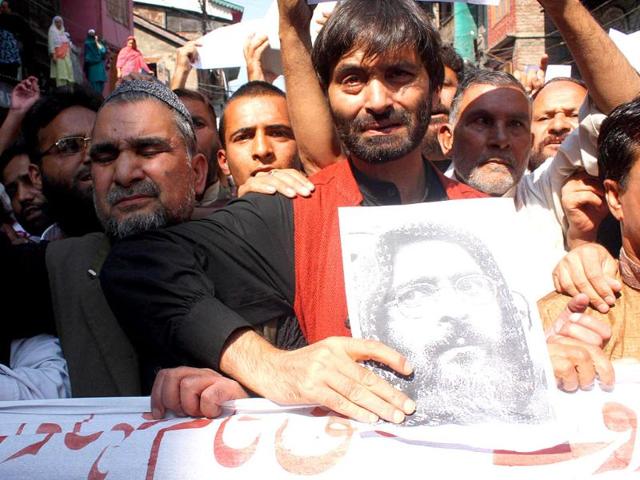 Chairman of Jammu and Kashmir Liberation Front Mohammad Yaseen Malik alongwith his supporters and party leaders during a protest against the hanging of Parliament attack convict Afzal Guru at Lal chowk in Srinagar.