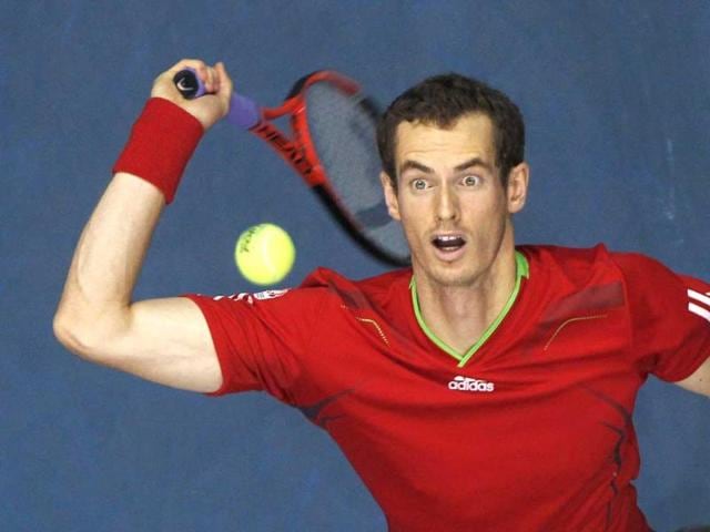 Andy Murray of Britain serves to Grigor Dimitrov of Bulgaria during their men's singles quarterfinal match at the PTT Thailand Open tennis tournament in Bangkok.