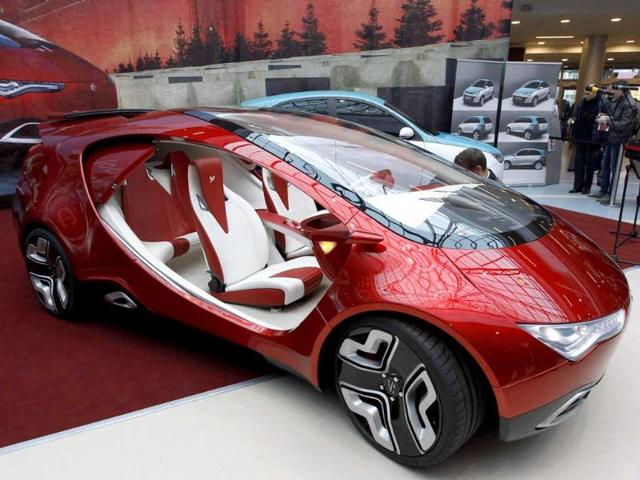 Visitors view a hybrid concept car from Russian car manufacturer e-Auto shown for the first time to the Russian public in St. Petersburg.
