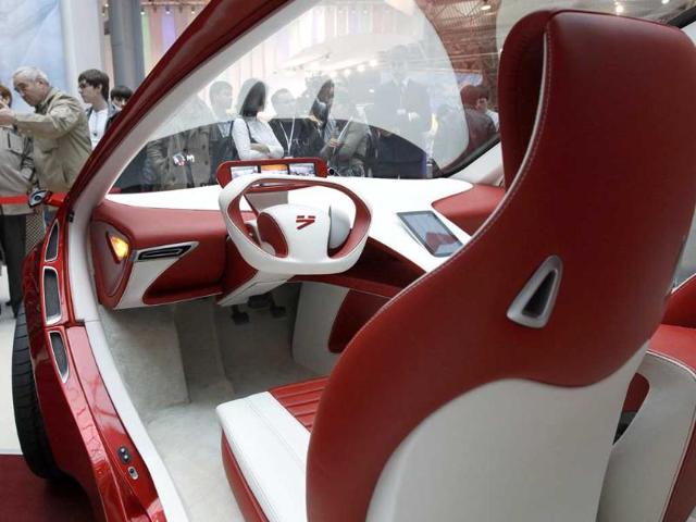 Visitors view a hybrid concept car from Russian car manufacturer e-Auto shown for the first time to the Russian public in St. Petersburg.