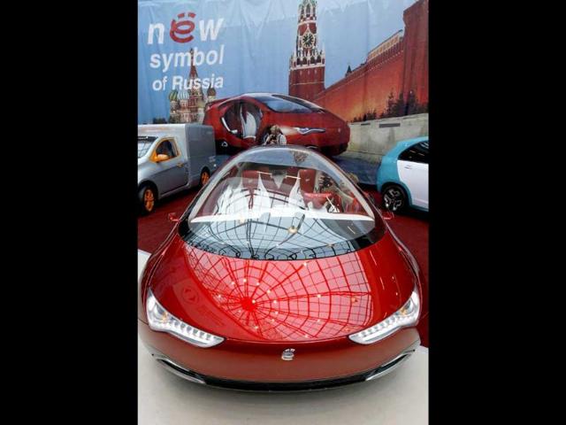 Visitors view a hybrid concept car from Russian car manufacturer e-Auto shown for the first time to the Russian public in St. Petersburg.