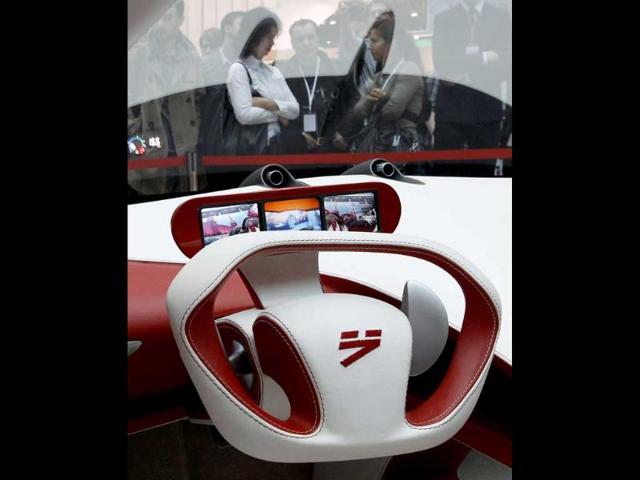 Visitors view a hybrid concept car from Russian car manufacturer e-Auto shown for the first time to the Russian public in St. Petersburg.