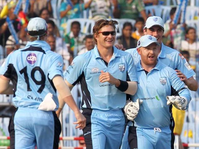 New South Wales Blues Shane Watson celebrates with team mates after catching Mumbai Indians Ambati Rayudu during the CLT20 match at the MA Chidambaram Stadium in Chennai.