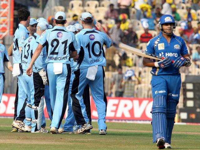 New South Wales Blues celebrate the dismissal of Mumbai Indians Sarul Kanwar during their Champions League Trophy T20 match at the MA Chidambaram Stadium in Chennai.