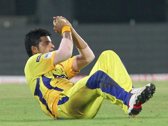 Chennai Super Kings Suresh Raina takes a catch during the CLT20 match against Trinidad and Tobago at The MA Chidambaram Stadium in Chennai.