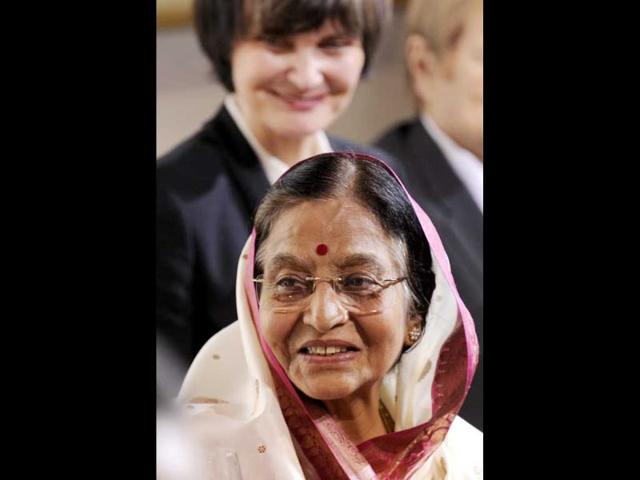 President Pratibha Patil (front) stands with Swiss President Micheline Calmy-Rey during the official welcome ceremony for her visit to Switzerland in Bern.