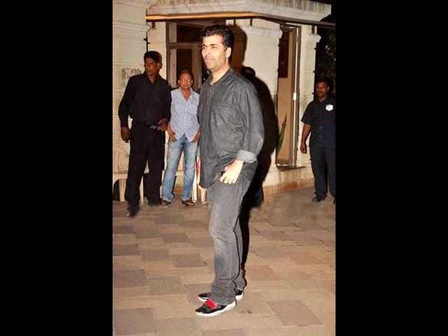 Director Karan Johar arrives at the party.