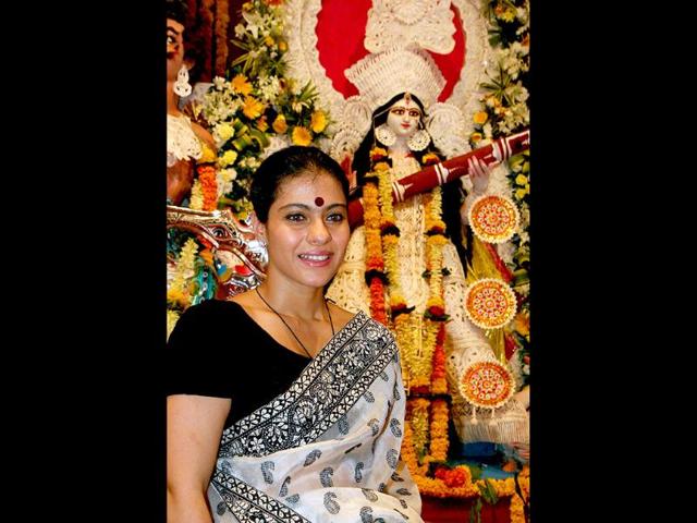 Kajol looks a true-blue Bengali in front of the Durga idol.
