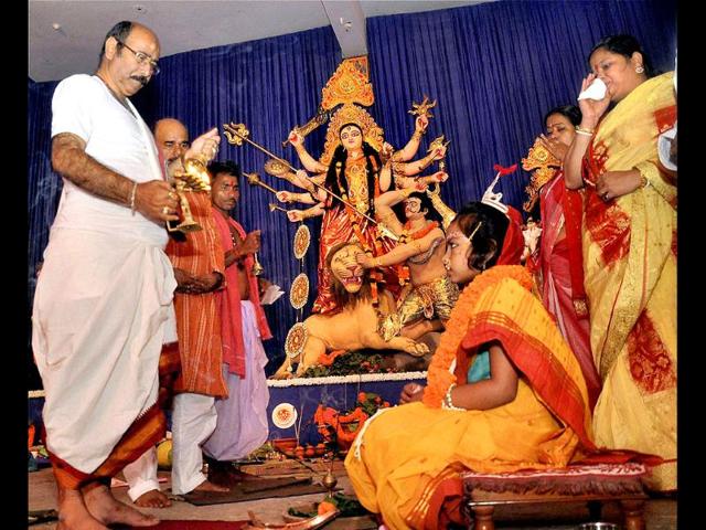 Priests perform 'Kunwari Kanya' puja on the auspicious Maha Ashtami of Durga Puja at a pandal in Ranchi.