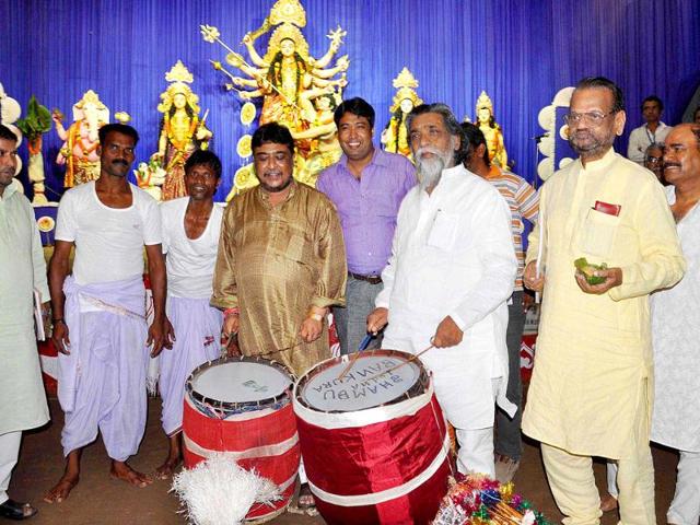 Jharkhand Mukti Morcha (JMM) Supremo Shibu Soren playing the traditional drum 'Dhak' on the auspicious Maha Ashtami of Durga Puja at a Pandaal in Ranchi.