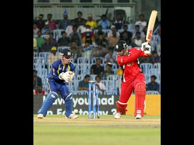 Team captain of Trinidad and Tobago Daren Ganga is bowled out by captain of Cape Cobras Justing Kemp during their Champions League Trophy T20 cricket match at MA Chidambaram Stadium in Chennai.