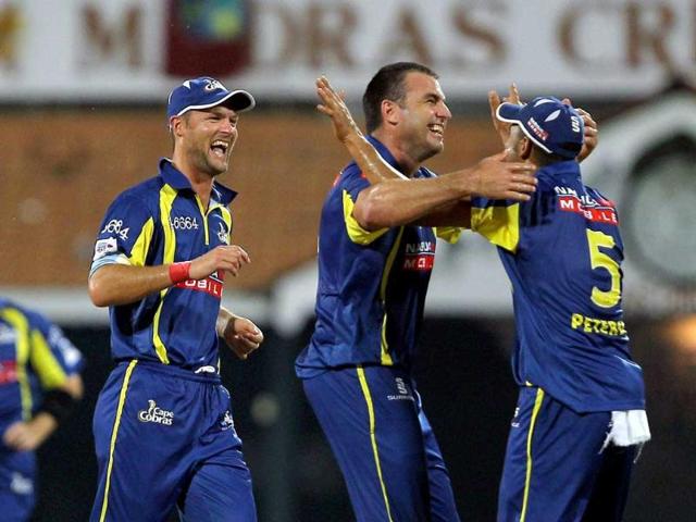 Cape Cobras' skipper Justin Kemp along with teammates celebrating the wicket of Trinidad and Tobago's Skipper Daren Ganga during the Champions league T20-2011 match in Chennai.