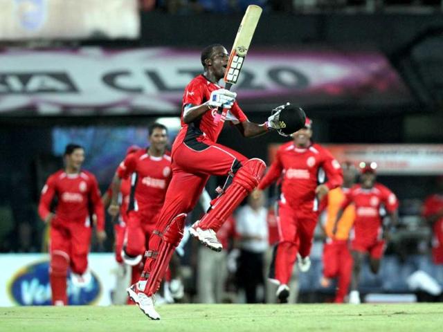 Trinidad and Tobago batsman Kevon Cooper and team mates celebrate after won the match against Cape Cobras during the champions league at MA Chidambaram Stadium in Chennai.
