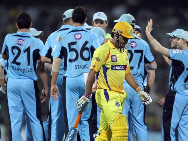 Chennai Super Kings' skipper MS Dhoni returns to pavilion after losing his wicket during the Champions League T20-2011 match against New South Wales Blues in Chennai.