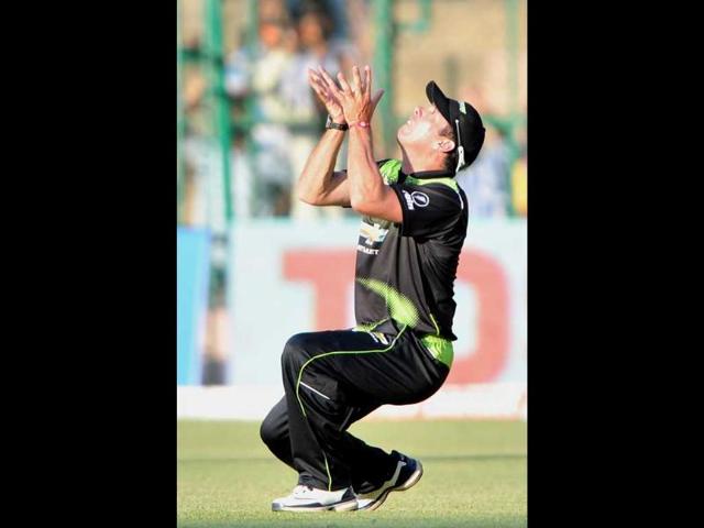 Warriors fielder Nicky Boje prepares to catch the ball of Somerset batsman Joss Buttler (unseen), during the Champions League Twenty20 League cricket match between Warriors and Somerset at the M. Chinnaswamy Stadium in Bangalore.