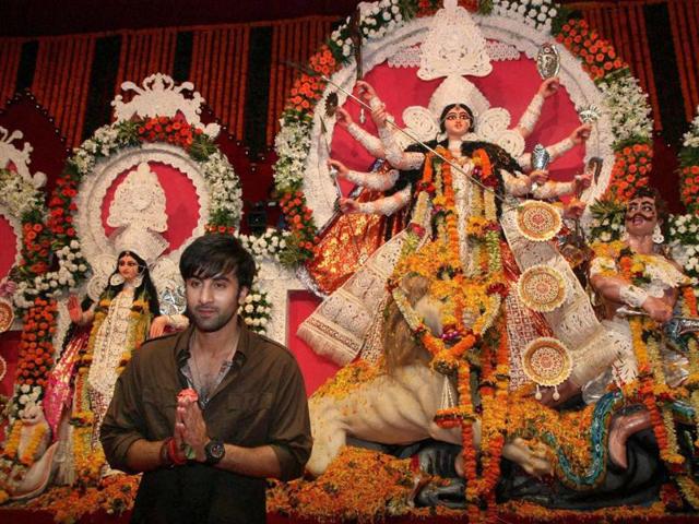 Ranbir Kapoor prays in front of a Durga idol.