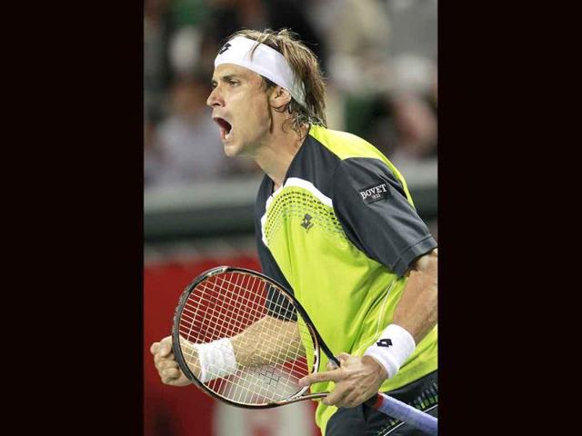 David Ferrer of Spain celebrates after winning over Radek Stepanek of Czech Republic in their quarterfinal match at the Japan Open tennis tournament in Tokyo. Ferrer beat Stepanek 6-2, 7-6 (3).