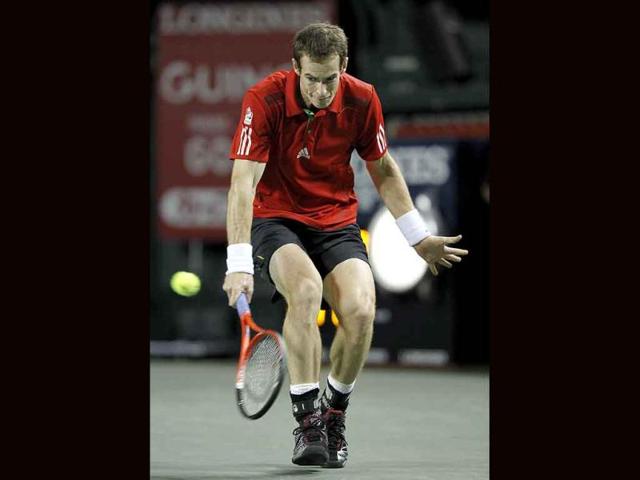 Andy Murray of Britain returns a shot to David Nalbandian of Argentina during their quarter-final match at the Japan Open tennis championships in Tokyo.