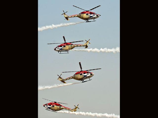 Advanced Light Helicopters (ALH) of the Indian Air Force's Sarang team perform during the Air Force Day parade at Air Force Station Hindon in Ghaziabad on the outskirts of New Delhi.