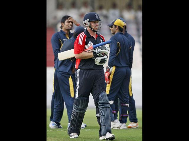 England XI cricketer Ian Bell walks back to the pavilion after being dismissed by Hyderabad XI's Ashish Reddy during a practice match in Hyderabad, India.