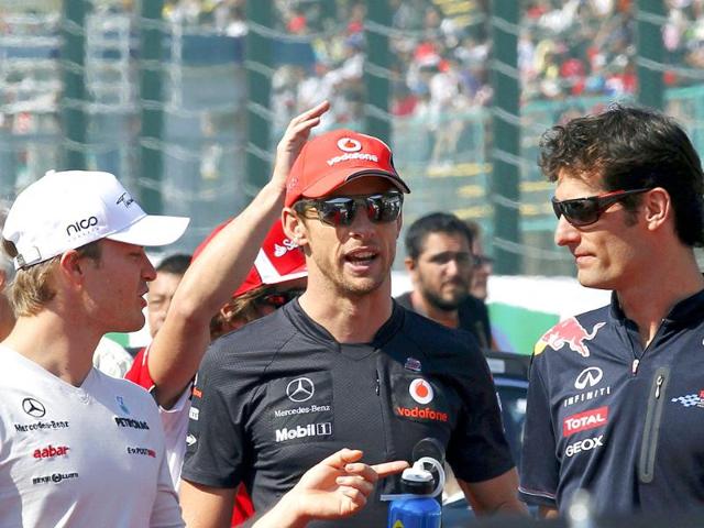 Mercedes-Formula-One-driver-Nico-Rosberg-of-Germany-L--McLaren-Formula-One-driver-Jenson-Button-of-Britain-C-and-Red-Bull-Formula-One-driver-Mark-Webber-of-Australia-talk-before-the-drivers-parade-ahead-of-the-Japanese-F1-Grand-Prix-at-the-Suzuka-circuit Mercedes-Formula-One-driver-Nico-Rosberg-of-Germany-L--McLaren-Formula-One-driver-Jenson-Button-of-Britain-C-and-Red-Bull-Formula-One-driver-Mark-Webber-of-Australia-talk-before-the-drivers-parade-ahead-of-the-Japanese-F1-Grand-Prix-at-the-Suzuka-circuit