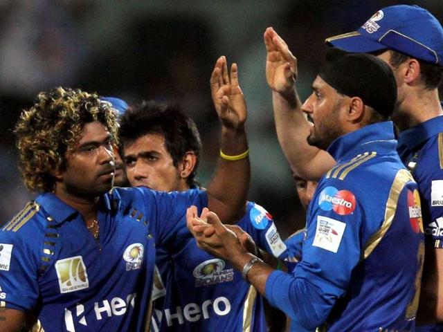 Mumbai Indians celebrate the wicket of Dilshan during CLT20 final match between Mumbai Indians and Royal Challegers Bangalore at Chidambaram stadium in Chennai.