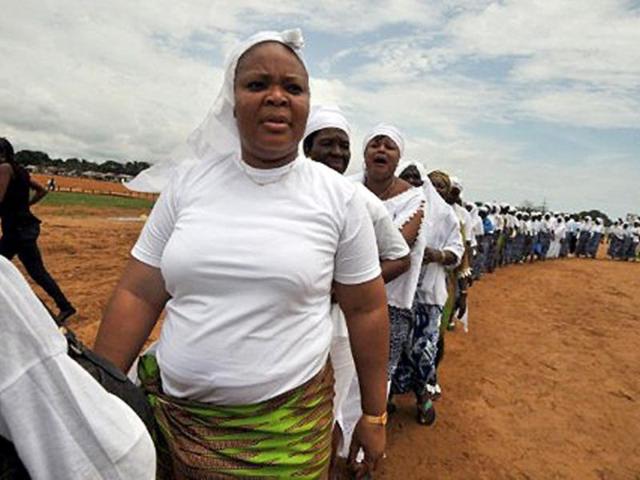 Liberia's joint Nobel Peace Prize 2011 Leymah Gbowee and fellow women's rights activists gather on a dusty soccer field in Monrovia.