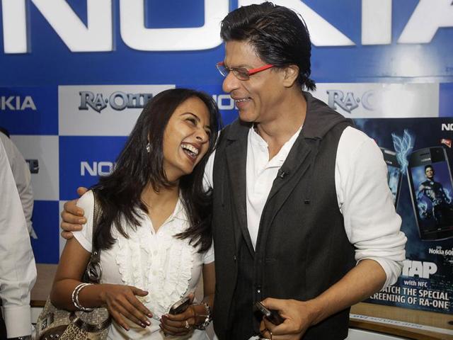 King Khan greets a customer who received the first ticket released for his upcoming film.