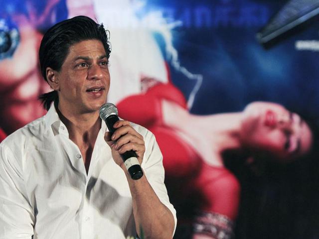 SRK in front of RA.One poster.