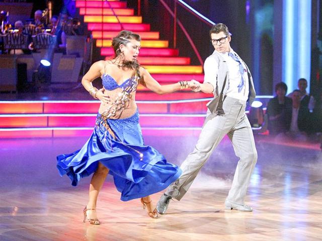 In this image released by ABC, TV personality Rob Kardashian and his partner Cheryl Burke perform on the celebrity dance competition series Dancing with the Stars in Los Angeles.