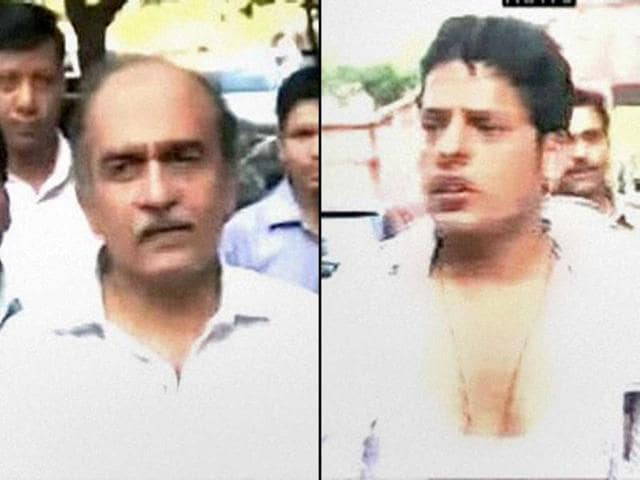 A combo TV Grab courtesy Times Now shows- Supreme Court lawyer-activist Prashant Bhushan and his attacker Inder Verma, president of Sri Ram Sena in New Delhi