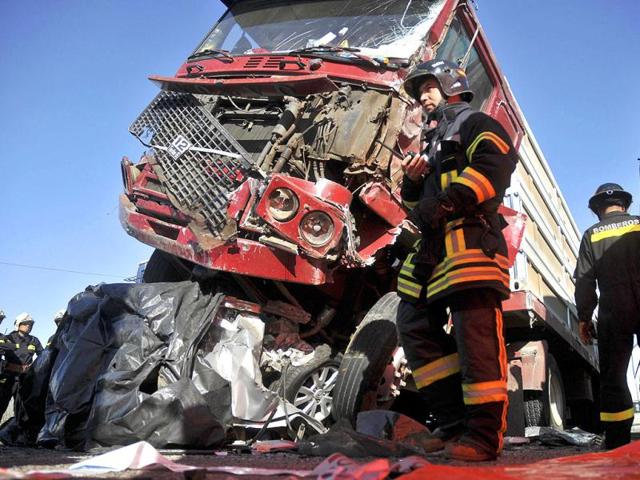 Firefighters work at the scene of a multi-vehicle pile-up on a highway in Casablanca, about 43 miles or 70 kilometers from Santiago, Chile.