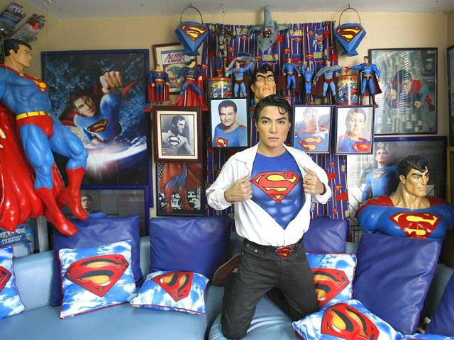 Herbert Chavez poses with his Superman memorabilia inside his house in Calamba Laguna, south of Manila.