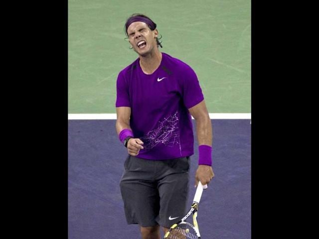 Rafael Nadal of Spain reacts after losing a point to Florian Mayer of Germany during their men's singles third round match of the Shanghai Masters tennis tournament in Shanghai, China. Mayer upset Nadal 7-6 (5), 6-3.