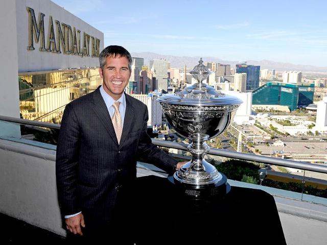 IndyCar CEO Randy Bernard poses with the new IndyCar Series world championship trophy during a photo opportunity at the House of Blues Foundation Room inside the Mandalay Bay Resort in Las Vegas, Nevada. IndyCar CEO Randy Bernard poses with the new IndyCar Series world championship trophy during a photo opportunity at the House of Blues Foundation Room inside the Mandalay Bay Resort in Las Vegas, Nevada.