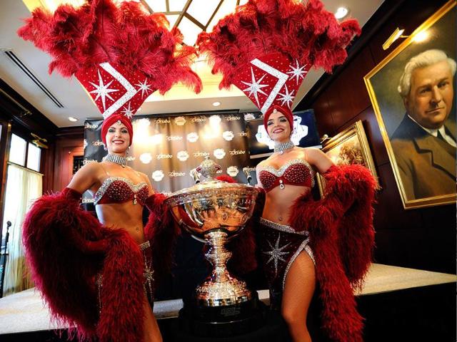 Models Janell Lewis (L) and Porsha Revesz pose with the new IndyCar Series championship trophy at a media day news conference at the Capital Grille at the Fashion Show mall in Las Vegas, Nevada. Models Janell Lewis (L) and Porsha Revesz pose with the new IndyCar Series championship trophy at a media day news conference at the Capital Grille at the Fashion Show mall in Las Vegas, Nevada.