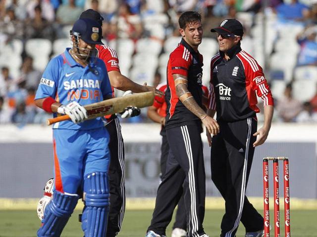 England's Jade Dernbach (C) celebrates after dismissing Gautam Gambhir during their first one-day international cricket match in Hyderabad.