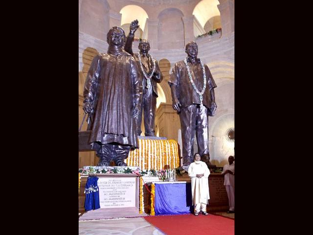 Uttar Pradesh chief minister Mayawati (bottom right) stands near statues of herself (L) Bhimrao Ramji Ambedkar (C) and Bahujan Samaj Party leader Kansi Ram in a hall at a newly inaugurated park in Noida. (Photo: AP Photo)