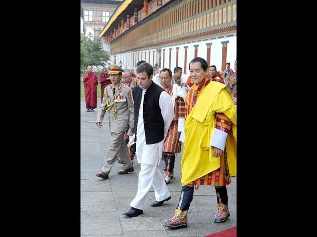 Indian MP Rahul Gandhi walks with former Bhutan King Jigme Sinagye Wangchuk during a ceremony for the newly wed Bhutanese royal couple in Thimphu.